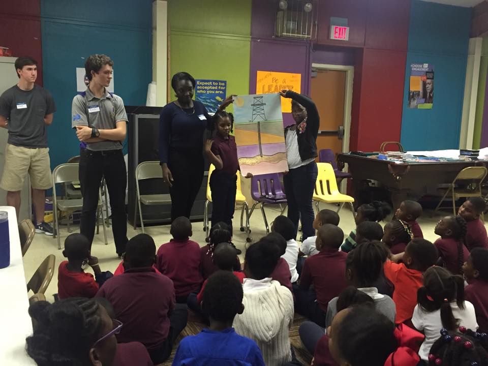 Zach Larson and Denise Owusu teach the Boys and Girls Club of Baton Rouge about petroleum engineering